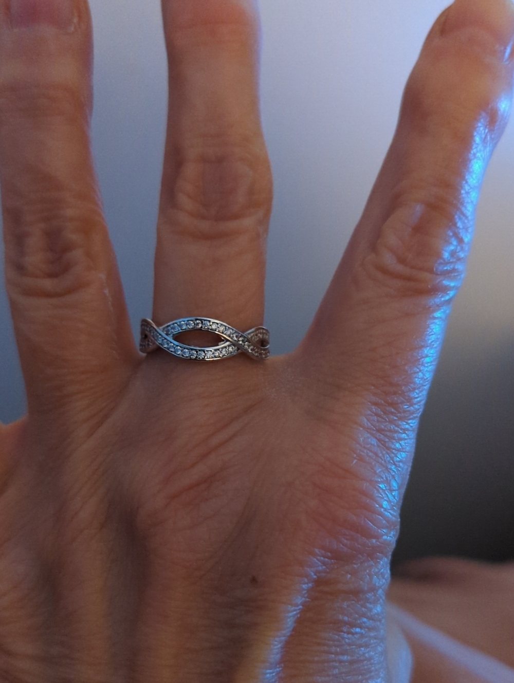 Sterling Silver Infinity Twist Ring with  Clear Stones - Silver